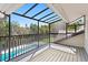 Balcony view of a pool and lush foliage at 16403 Zurraquin De Avila, Tampa, FL 33613