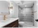 Modern bathroom features glass shower, floating vanity, and designer fixtures at 16403 Zurraquin De Avila, Tampa, FL 33613