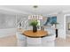 Open-concept dining room featuring travertine floors and ample natural light at 16403 Zurraquin De Avila, Tampa, FL 33613
