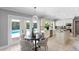 Bright kitchen featuring a dining nook, French doors to the pool, and granite countertops at 16403 Zurraquin De Avila, Tampa, FL 33613