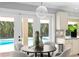 Kitchen nook featuring a round table with seating for four and backyard views at 16403 Zurraquin De Avila, Tampa, FL 33613