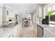 Bright kitchen with a view to dining nook and granite countertops at 16403 Zurraquin De Avila, Tampa, FL 33613