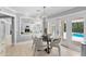 Bright kitchen featuring a dining nook, and view to the living room and pool at 16403 Zurraquin De Avila, Tampa, FL 33613
