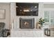 Cozy living room with stone fireplace and adjacent seating area at 16403 Zurraquin De Avila, Tampa, FL 33613