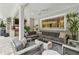Comfortable outdoor living with custom seating, fire pit, and outdoor kitchen at 16403 Zurraquin De Avila, Tampa, FL 33613