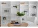 Built-in shelves filled with books, plants, and decorative items at 16403 Zurraquin De Avila, Tampa, FL 33613