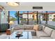 Well-decorated living room featuring a comfortable sectional sofa, stylish decor, and a view of the outdoor terrace at 199 Dali Blvd # 407, St Petersburg, FL 33701