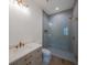 Elegant bathroom featuring a frameless glass shower, modern vanity, and stylish gold-toned fixtures, offering a spa-like experience at 2622 N Dundee St, Tampa, FL 33629
