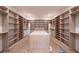 Spacious walk-in closet with custom shelving and ample storage space at 2622 N Dundee St, Tampa, FL 33629