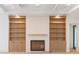 Inviting living room with a fireplace, custom built-ins, and recessed lighting at 2622 N Dundee St, Tampa, FL 33629