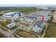 Aerial view of waterfront townhomes, showcasing community layout and boat docks near the marina at 3027 Bermuda Sloop Cir, Ruskin, FL 33570