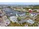 Overhead view of waterfront homes with private boat docks, surrounded by lush landscaping and the marina at 3027 Bermuda Sloop Cir, Ruskin, FL 33570