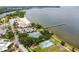 Aerial view showcasing the community's tennis courts, playground, beach, and waterfront amenities at 3027 Bermuda Sloop Cir, Ruskin, FL 33570