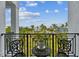 Balcony with outdoor seating and views of landscaped surroundings, blue skies, and other houses at 3027 Bermuda Sloop Cir, Ruskin, FL 33570