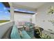 Spacious balcony with outdoor seating and a built-in grill, perfect for entertaining at 3027 Bermuda Sloop Cir, Ruskin, FL 33570