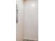 Interior view of elevator with wood grain walls and push-button controls at 3027 Bermuda Sloop Cir, Ruskin, FL 33570