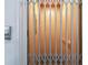 Elevator with a folding gate door and controls at 3027 Bermuda Sloop Cir, Ruskin, FL 33570