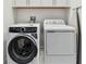 Modern laundry room features an Electrolux washer and dryer at 3027 Bermuda Sloop Cir, Ruskin, FL 33570
