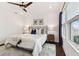 Comfortable main bedroom with neutral colors and a ceiling fan at 3027 Bermuda Sloop Cir, Ruskin, FL 33570