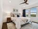 Bright main bedroom features a large window with beautiful outside views at 3027 Bermuda Sloop Cir, Ruskin, FL 33570