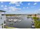 Scenic marina view with boats docked, under a blue sky with scattered clouds at 3027 Bermuda Sloop Cir, Ruskin, FL 33570