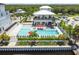 Aerial shot of a community pool and lounge area with modern outdoor seating and landscaping at 3027 Bermuda Sloop Cir, Ruskin, FL 33570