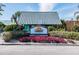 Exterior of the Sunset Grill & Beach Bar with attractive sign and tropical landscaping at 3027 Bermuda Sloop Cir, Ruskin, FL 33570
