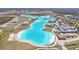 Aerial view of lagoon and nearby community at 31814 Oyster Trellis Ln, Wesley Chapel, FL 33545