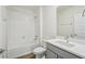 Bright bathroom features a shower-tub combination and stylish vanity at 31814 Oyster Trellis Ln, Wesley Chapel, FL 33545
