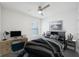 Staged bedroom with bed, nightstands, and desk at 31814 Oyster Trellis Ln, Wesley Chapel, FL 33545