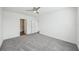 Spacious bedroom featuring gray carpeting, a ceiling fan, and neutral paint at 31814 Oyster Trellis Ln, Wesley Chapel, FL 33545