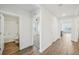 Hallway featuring bathroom, bedroom, and kitchen access at 31814 Oyster Trellis Ln, Wesley Chapel, FL 33545