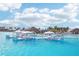 Inviting lagoon view featuring in-water lounge pods and clear turquoise water surrounded by resort-style amenities at 31814 Oyster Trellis Ln, Wesley Chapel, FL 33545