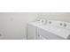 Laundry room featuring washing machine and dryer at 31814 Oyster Trellis Ln, Wesley Chapel, FL 33545