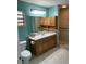 Bathroom featuring shower, vanity and window providing natural light at 37634 Hidden Park Ct, Dade City, FL 33525