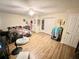 Spacious bedroom features wood laminate flooring, fan, and closet for optimal storage at 37634 Hidden Park Ct, Dade City, FL 33525