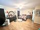 Bright bedroom featuring wood laminate flooring, fan, and closet for optimal storage at 37634 Hidden Park Ct, Dade City, FL 33525