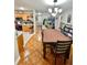 Inviting dining space with a large dining table, seamlessly connecting to the kitchen at 37634 Hidden Park Ct, Dade City, FL 33525