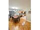 Inviting dining room adjacent to kitchen with stylish chandelier and modern furnishings at 37634 Hidden Park Ct, Dade City, FL 33525