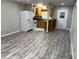 Bright kitchen with laminate flooring, ample cabinet space, and modern appliances at 37634 Hidden Park Ct, Dade City, FL 33525