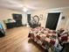 Spacious main bedroom with wood flooring, a ceiling fan, and ample closet space at 37634 Hidden Park Ct, Dade City, FL 33525