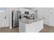 The kitchen boasts stainless steel appliances, granite countertops, and a central island at 4621 Kenoska St, North Port, FL 34288