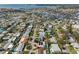 Expansive aerial showcasing residential neighborhood with mature trees and proximity to the bay, creating a scenic backdrop at 5166 39Th S St, St Petersburg, FL 33711