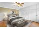 Stylish bedroom with a modern color scheme, a ceiling fan, and built-in wardrobe/storage at 5166 39Th S St, St Petersburg, FL 33711