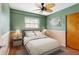 Charming bedroom with hardwood floors, a ceiling fan, and tranquil color scheme at 5166 39Th S St, St Petersburg, FL 33711