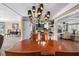Dining area showcasing a stylish chandelier and views into the updated kitchen and living room at 5166 39Th S St, St Petersburg, FL 33711