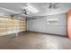 Spacious garage with a large door, concrete floor, and bright lighting, ready for vehicles and storage at 5166 39Th S St, St Petersburg, FL 33711