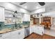 Bright kitchen featuring stainless steel appliances, granite countertops, and a spacious sink at 5166 39Th S St, St Petersburg, FL 33711
