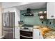 Modern kitchen features stainless steel appliances, a subway tile backsplash, and stylish countertops at 5166 39Th S St, St Petersburg, FL 33711