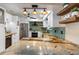 Renovated kitchen with granite counters, stainless steel appliances, and modern finishes at 5166 39Th S St, St Petersburg, FL 33711